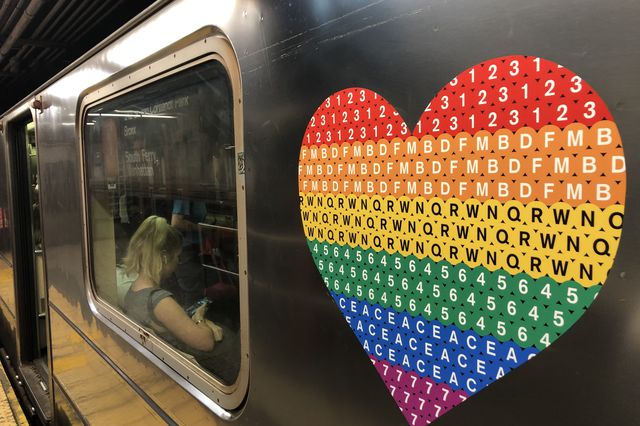 The MTA Pride logo seen on the 1 train (Photograph © Howard Sherman)